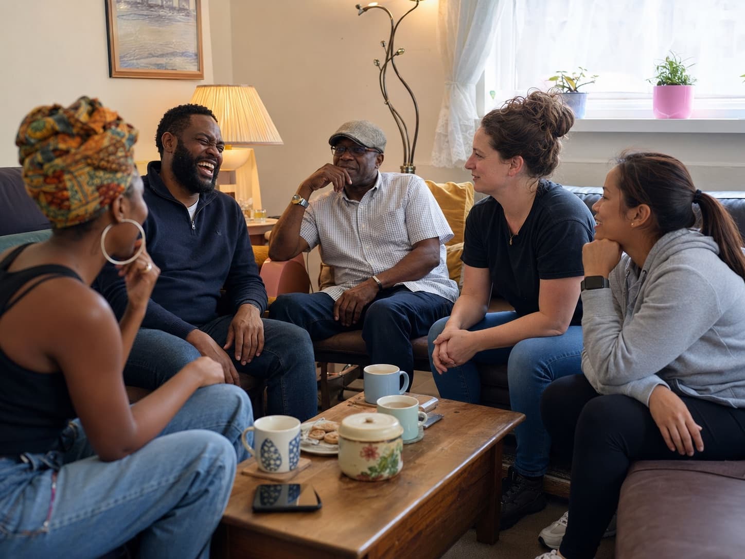 Members of the community chatting warmly together, love, grace and compassion in practice